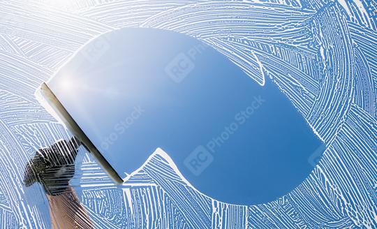 window cleaner cleaning window with squeegee and wiper on a sunny day  : Stock Photo or Stock Video Download rcfotostock photos, images and assets rcfotostock | RC Photo Stock.: