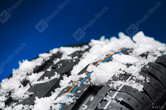 winter tires with snow and ice on blue background  : Stock Photo or Stock Video Download rcfotostock photos, images and assets rcfotostock | RC Photo Stock.:
