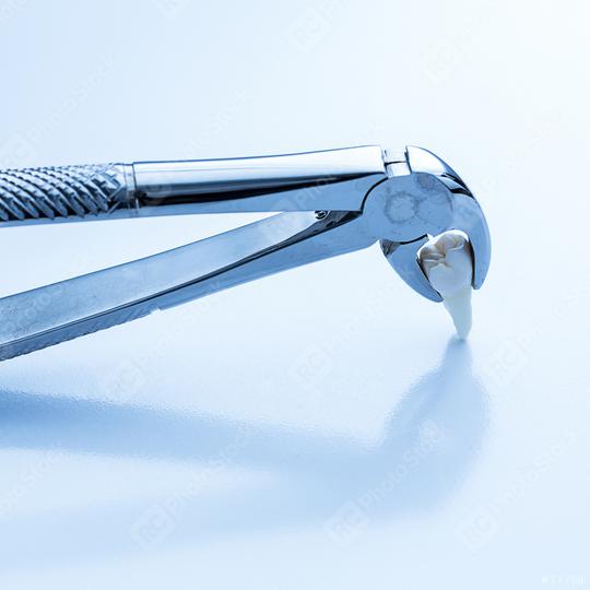 Wisdom tooth forceps by the dentist for dental treatment  : Stock Photo or Stock Video Download rcfotostock photos, images and assets rcfotostock | RC Photo Stock.: