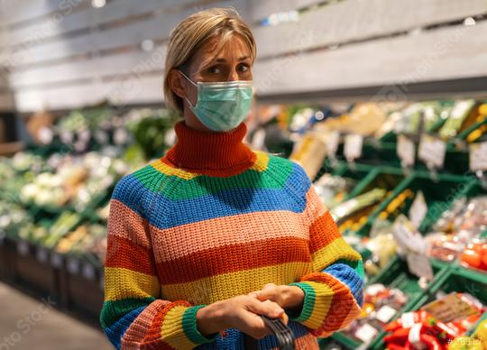 Woman at supermarket in the fruit section wearing an anti virus protection mask due to covid-19  Coronavirus pandemic   : Stock Photo or Stock Video Download rcfotostock photos, images and assets rcfotostock | RC Photo Stock.: