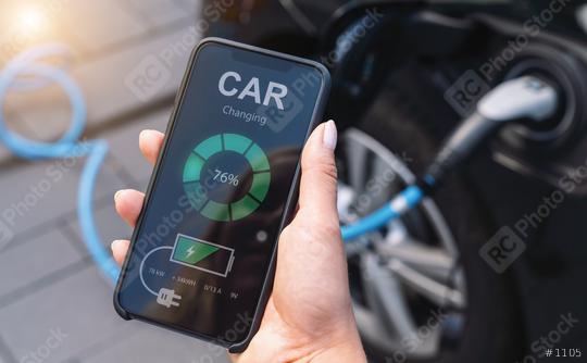 Woman Charging Electric car with Cable Looking at App On Mobile Phone. Close up of smartphone screen. Hand holding smart device. Mobile application for eco transportation.   : Stock Photo or Stock Video Download rcfotostock photos, images and assets rcfotostock | RC Photo Stock.: