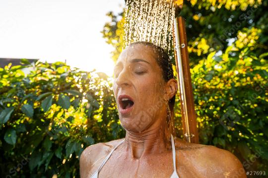 woman enjoying relax shower after sauna in spa garden at sunset. Golden Hour Refreshment Hotel and wellness concept image  : Stock Photo or Stock Video Download rcfotostock photos, images and assets rcfotostock | RC Photo Stock.: