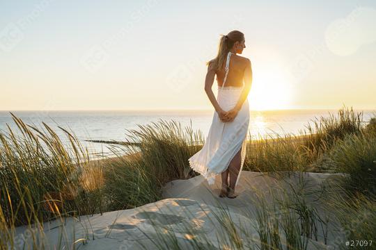 Woman finding freedom in dunes at Sunset. Sea beach view summer with woman dressed fashion style in white dress. vacation concept image  : Stock Photo or Stock Video Download rcfotostock photos, images and assets rcfotostock | RC Photo Stock.: