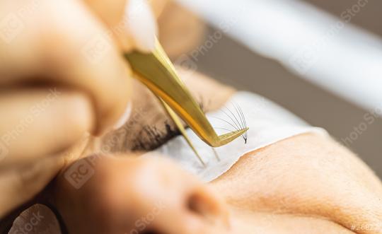 Woman gets Long Eyelashes with tweezers from Cosmetician at  cos  : Stock Photo or Stock Video Download rcfotostock photos, images and assets rcfotostock | RC Photo Stock.: