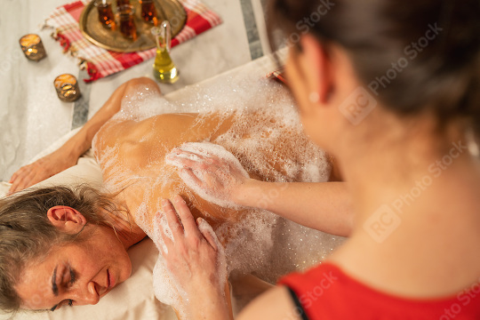 woman getting massage in Spa, it is a massage with foam, Wellnes  : Stock Photo or Stock Video Download rcfotostock photos, images and assets rcfotostock | RC Photo Stock.:
