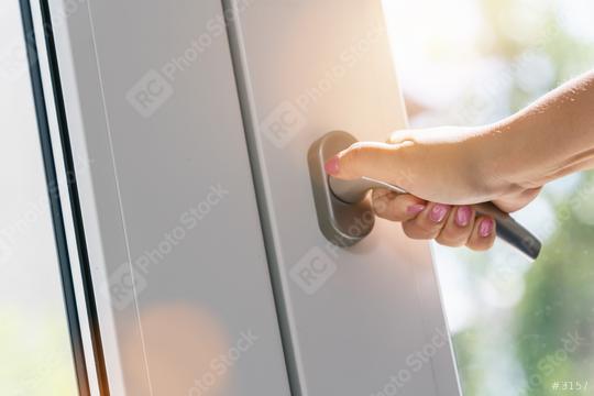 woman hand close white plastic pvc window at home  : Stock Photo or Stock Video Download rcfotostock photos, images and assets rcfotostock | RC Photo Stock.: