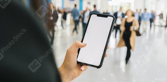Woman hand holding black cellphone with white screen at a trade fair, copyspace for your individual text.  : Stock Photo or Stock Video Download rcfotostock photos, images and assets rcfotostock | RC Photo Stock.: