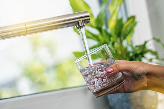 woman hand holds a glass to Filing it with water from tap  : Stock Photo or Stock Video Download rcfotostock photos, images and assets rcfotostock | RC Photo Stock.: