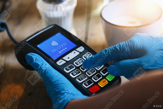 Woman hand with medical latex protective gloves holds payment terminal and enters PIN code at a cafe. Protection for Coronavirus or COVID-19.   : Stock Photo or Stock Video Download rcfotostock photos, images and assets rcfotostock | RC Photo Stock.: