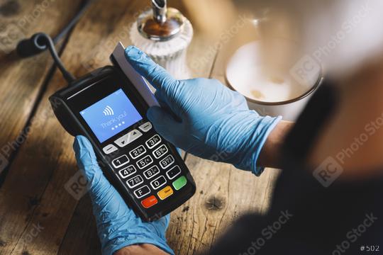 Woman hand with medical latex protective gloves swipe  credit card through terminal forpay in restaurant. Protection for Coronavirus COVID-19.   : Stock Photo or Stock Video Download rcfotostock photos, images and assets rcfotostock | RC Photo Stock.: