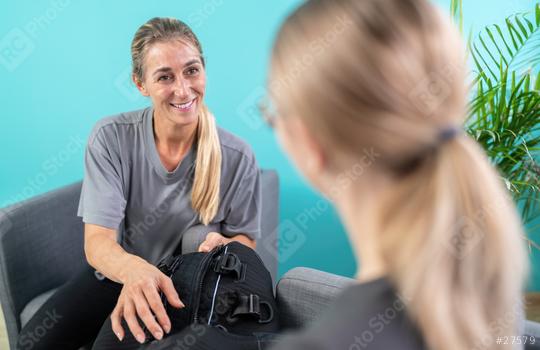 woman holding an EMS training suit while talking to a trainer in a consultation room
  : Stock Photo or Stock Video Download rcfotostock photos, images and assets rcfotostock | RC Photo Stock.: