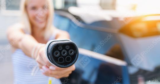 Woman holding type 2 plug charging cable for EV Car or Electric car. Eco-friendly alternative energy concept, banner size, copy space for text  : Stock Photo or Stock Video Download rcfotostock photos, images and assets rcfotostock | RC Photo Stock.: