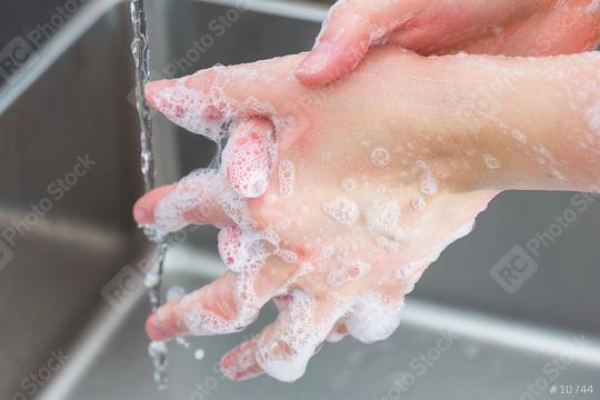Woman in a bathrobe is washing hands  : Stock Photo or Stock Video Download rcfotostock photos, images and assets rcfotostock | RC Photo Stock.: