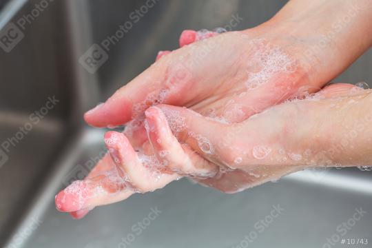 Woman in a kitchen is washing hands  : Stock Photo or Stock Video Download rcfotostock photos, images and assets rcfotostock | RC Photo Stock.: