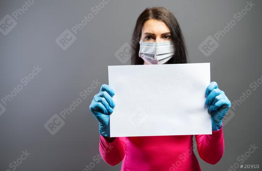 woman in medical mask and gloves showing empty blank paper as sign of protest in her hands. Focus on a piece of paper. prevent others from corona COVID-19 and SARS cov 2 infection, copy space  : Stock Photo or Stock Video Download rcfotostock photos, images and assets rcfotostock | RC Photo Stock.: