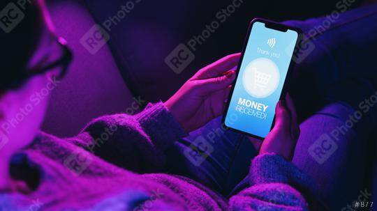 Woman lies on sofa and Received Payment or Money message on a mobile phone screen.  mobile phone with imaginary Banking or Payment service. Online bill payment concept.  : Stock Photo or Stock Video Download rcfotostock photos, images and assets rcfotostock | RC Photo Stock.: