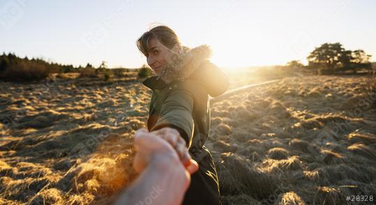 woman pulling guy