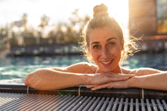 Woman relaxing in a pool at a hotel or spa resort, leaning on ed  : Stock Photo or Stock Video Download rcfotostock photos, images and assets rcfotostock | RC Photo Stock.: