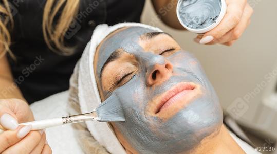 Woman relaxing with a charcoal facial mask in beauty center or cosmetology salon.   : Stock Photo or Stock Video Download rcfotostock photos, images and assets rcfotostock | RC Photo Stock.: