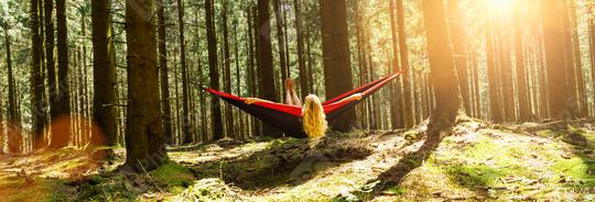 Woman resting in hammock outdoors. Relax and enjoy the nature in the forest  : Stock Photo or Stock Video Download rcfotostock photos, images and assets rcfotostock | RC Photo Stock.: