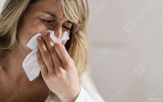 Woman sits in bed after corona infection, blowing her nose using paper napkin tissue. Sick woman suffering from running stuffy nose and sore throat. Cold and Flu Concept image  : Stock Photo or Stock Video Download rcfotostock photos, images and assets rcfotostock | RC Photo Stock.: