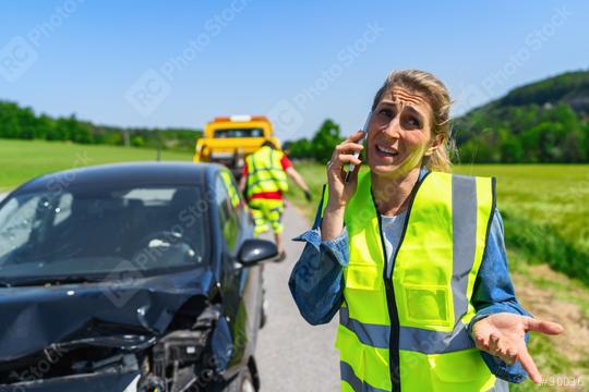 Woman tries to explain to her insurance company or her partner that she has been in a car accident and is now being towed away by a towing company.  : Stock Photo or Stock Video Download rcfotostock photos, images and assets rcfotostock | RC Photo Stock.:
