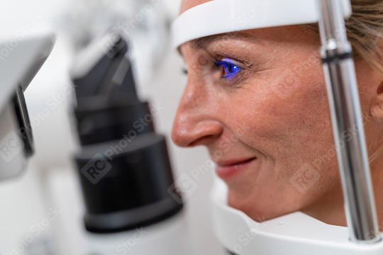 Woman undergoing an eye examination with a focus on her illumina  : Stock Photo or Stock Video Download rcfotostock photos, images and assets rcfotostock | RC Photo Stock.: