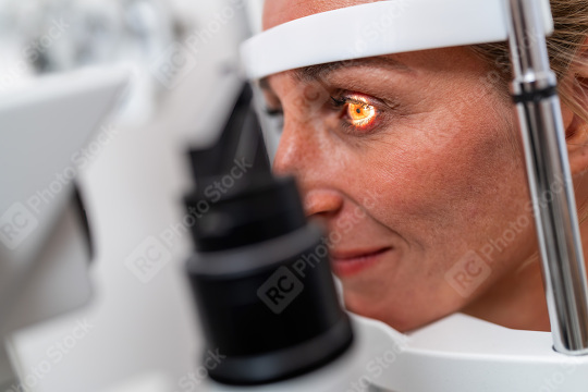 Woman undergoing an eye examination with a focus on her illumina  : Stock Photo or Stock Video Download rcfotostock photos, images and assets rcfotostock | RC Photo Stock.: