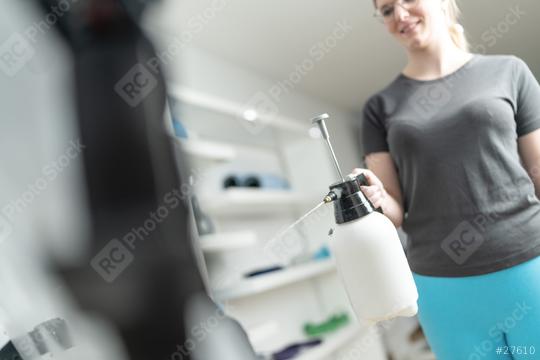 Woman using a pressurized spray bottle to preparing ems equipment for training in a EMS Studio  : Stock Photo or Stock Video Download rcfotostock photos, images and assets rcfotostock | RC Photo Stock.: