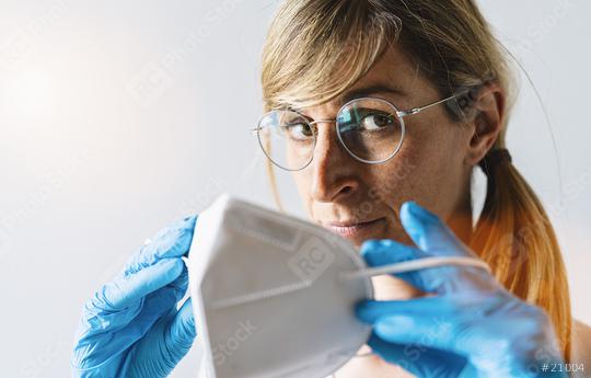 Woman wearing N95 FFP2 an anti virus protection mask to prevent others from corona COVID-19 and SARS cov 2 infection  : Stock Photo or Stock Video Download rcfotostock photos, images and assets rcfotostock | RC Photo Stock.: