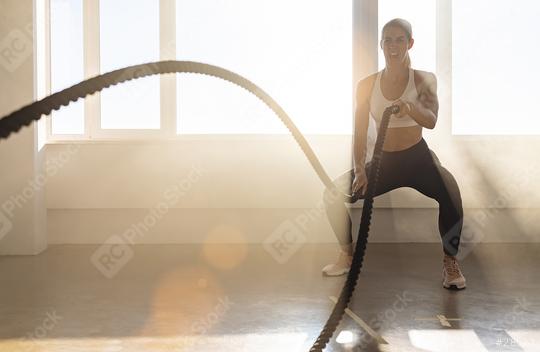 Woman with battle rope in functional training fitness gym  : Stock Photo or Stock Video Download rcfotostock photos, images and assets rcfotostock | RC Photo Stock.: