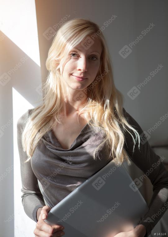 Woman with laptop near window  : Stock Photo or Stock Video Download rcfotostock photos, images and assets rcfotostock | RC Photo Stock.: