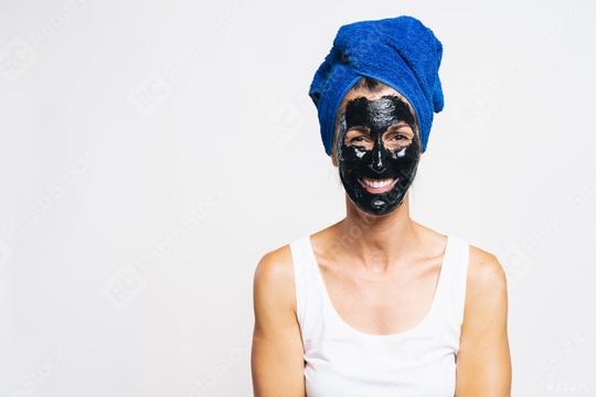 Woman with purifying black mask on her face and wrapped bath towel on the head   : Stock Photo or Stock Video Download rcfotostock photos, images and assets rcfotostock | RC Photo Stock.: