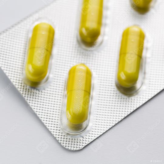 Yellow capsule Tablets doctor in a Blister packaging antibiotic pharmacy medicine medical  : Stock Photo or Stock Video Download rcfotostock photos, images and assets rcfotostock | RC Photo Stock.:
