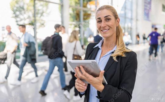 young beautiful businesswoman at a trade fair  : Stock Photo or Stock Video Download rcfotostock photos, images and assets rcfotostock | RC Photo Stock.: