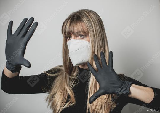 young, blond beautiful woman puts ffp2 protective mask on with protective medical gloves for protection against corona  : Stock Photo or Stock Video Download rcfotostock photos, images and assets rcfotostock | RC Photo Stock.: