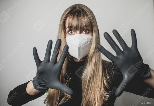 young, blond beautiful woman puts ffp2 protective mask on with protective medical gloves for protection against corona  : Stock Photo or Stock Video Download rcfotostock photos, images and assets rcfotostock | RC Photo Stock.: