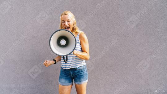 young blond woman shouting on a megaphone. copyspace for your individual text. business concept image  : Stock Photo or Stock Video Download rcfotostock photos, images and assets rcfotostock | RC Photo Stock.: