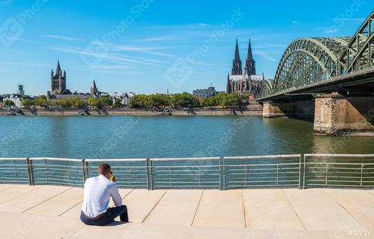 young businessman spending his time at the deutzer rhine boulevard in Cologne at summer  : Stock Photo or Stock Video Download rcfotostock photos, images and assets rcfotostock | RC Photo Stock.: