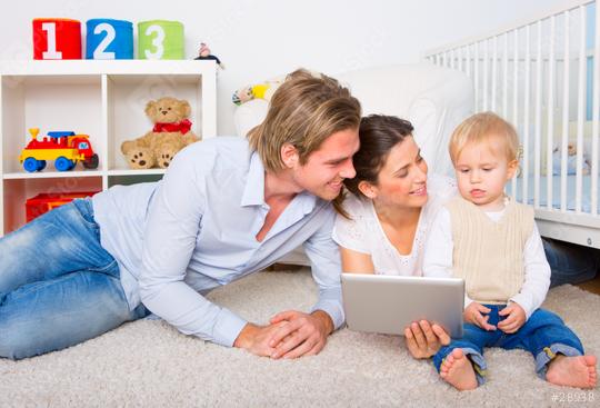 Young family with a toddler playing together on the floor, using a tablet in a bright and organized nursery with colorful toys, a teddy bear, and a crib in the background
  : Stock Photo or Stock Video Download rcfotostock photos, images and assets rcfotostock | RC Photo Stock.: