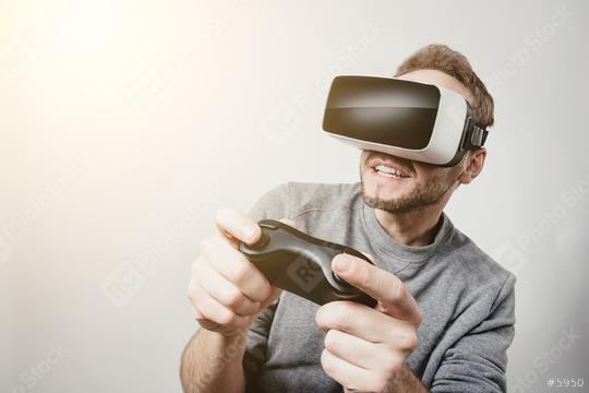 young gamer wearing Virtual Reality goggles VR Headset  : Stock Photo or Stock Video Download rcfotostock photos, images and assets rcfotostock | RC Photo Stock.: