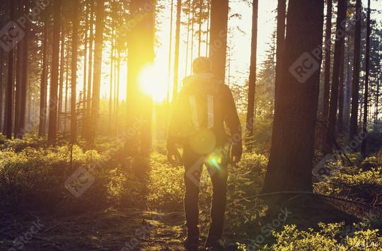 young hiker enjoying the faces of sunset in the woods  : Stock Photo or Stock Video Download rcfotostock photos, images and assets rcfotostock | RC Photo Stock.: