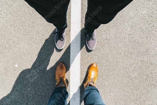young man and a business man stands opposite on the street with white line, high angle footsie or flortrait, personal pespective from above  : Stock Photo or Stock Video Download rcfotostock photos, images and assets rcfotostock | RC Photo Stock.:
