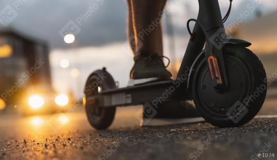 Young man at night with electric scooter or e-scooter in the city, Electric urban transportation concept image  : Stock Photo or Stock Video Download rcfotostock photos, images and assets rcfotostock | RC Photo Stock.: