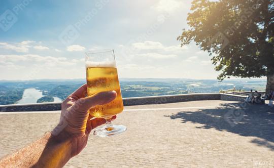 young man drinks fresh beer in a beer garden at summer  : Stock Photo or Stock Video Download rcfotostock photos, images and assets rcfotostock | RC Photo Stock.: