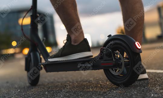 Young man is ready to discover the urban city at night with electric scooter or e-scooter, Electric urban transportation concept image  : Stock Photo or Stock Video Download rcfotostock photos, images and assets rcfotostock | RC Photo Stock.: