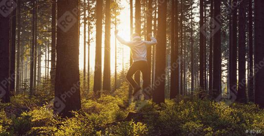 young man jumping in to the forest at sunset  : Stock Photo or Stock Video Download rcfotostock photos, images and assets rcfotostock | RC Photo Stock.: