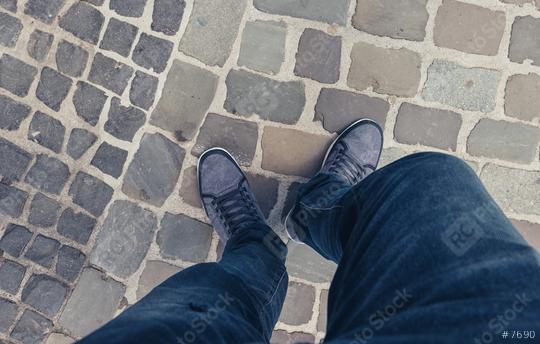 Young man standing in at the street in a oldtown in casually dressed sneakers, Point of view shot  : Stock Photo or Stock Video Download rcfotostock photos, images and assets rcfotostock | RC Photo Stock.: