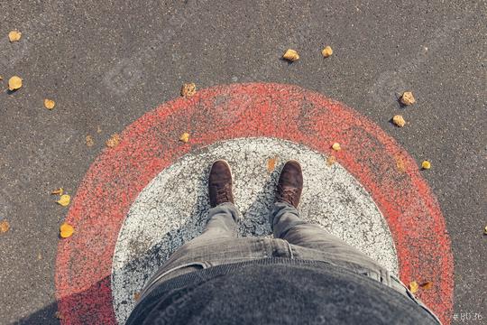 Young man stands in a circle at autumn on the streets, personal pespective from above.  : Stock Photo or Stock Video Download rcfotostock photos, images and assets rcfotostock | RC Photo Stock.: