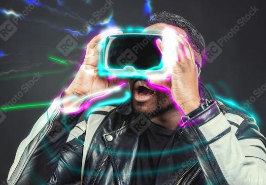 Young man wearing virtual reality googles / VR Glasses  : Stock Photo or Stock Video Download rcfotostock photos, images and assets rcfotostock | RC-Photo-Stock.: